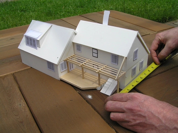 a scale model of a house with a pergola