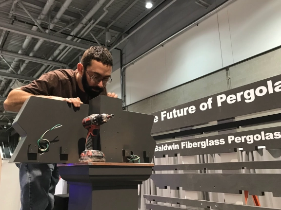 a picture of Mike setting up at an architecture show