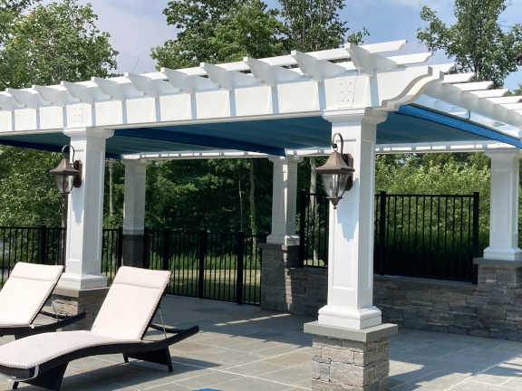Poolside fiberglass pergola with canopy in Connecticut