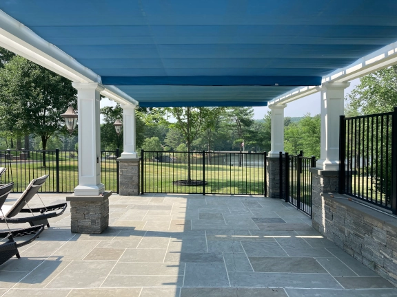 Poolside fiberglass pergola with canopy in Connecticut